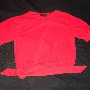A red cropped t-shirt.